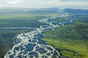 Aerial view, glacial river meandering over the sandy surface of the Skeioararsandur Aerial view, glacial river meandering over the sandy surface of the Skeioararsandur