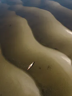 Aerial view of a man in a canoe on the Saint John River, New Brunswick, Canada Aerial view of a man in a canoe on the Saint John River, New Brunswick, Canada