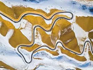 aerial view of roads in mountain range in xinjiang, west china aerial view of roads in mountain range in xinjiang, west china