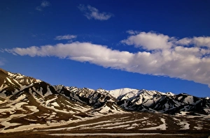 Alaska, Denali National park, cumulous clouds, Alaska Range in spring snow Alaska, Denali National park, cumulous clouds, Alaska Range in spring snow