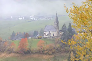 Alpine church at fall St. Magdalena Funes Valley Alpine church at fall St. Magdalena Funes Valley