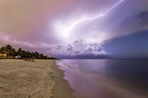 Amazing lightning storm sunset and calmed ocean, at Naples beach, Florida, USA Amazing lightning storm sunset and calmed ocean, at Naples beach, Florida, USA