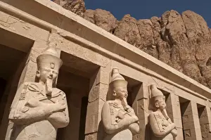 Prints of Osiride statues of the female Pharaoh at the entrance to the Mortuary Temple of Queen Hatshepsut, located on the west bank of Luxor in the Valley of the Kings in Egypt Images Dated 2008 October: Ancient Egypt Osiride Statue Print of Queen Hatshepsut