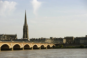 Arch bridge across a river, Pont de Pierre, St. Michel Basilica, Garonne River, Bordeaux Arch bridge across a river, Pont de Pierre, St. Michel Basilica, Garonne River, Bordeaux
