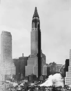 Prints of circa 1929: View of the Chrysler Building under the last stages of construction in midtown Manhattan, New York City. The tower is covered with scaffolding Embrace The Elegance: Art Deco Poster Art Collection: 1929 Chrysler Building Construction Print
