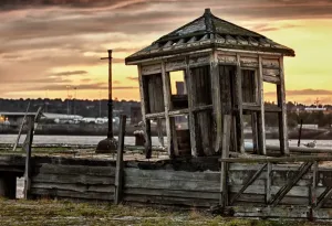 Prints of Collapsing shelter on pier by the side of the Mersey in Liverpool at sunset Liverpool Prints: Derelict Mersey Pier Shack Print at Sunset