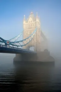 Prints of The morning sun burns through the London fog, illuminating Tower Bridge across the Thames World Famous Bridges Prints: Tower Bridge Glows in the Fog Print - London Thames Scene