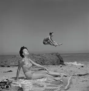 Prints of Puerto Rican actress Rita Moreno sunbathing as American actor Steve Rowland jumps in the background, on a beach, US, circa 1950. (Photo by Graphic House/Archive Photos/Getty Images) Rita Prints: Rita Moreno Sunbathing Print