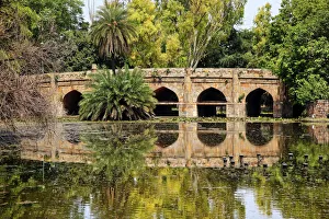Athpula Eight Piers Stone Bridge, 17th Century Bridge, Reflection of Lodi Gardens, New Delhi, India Athpula Eight Piers Stone Bridge, 17th Century Bridge, Reflection of Lodi Gardens, New Delhi, India