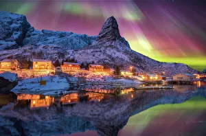 Aurora borealis above snowy islands of Lofoten Aurora borealis above snowy islands of Lofoten