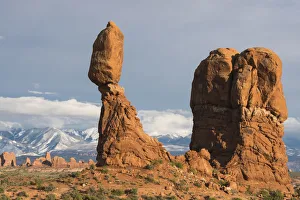 Balanced Rock in Arches National Park, with snow-covered La Sal mountains in background Balanced Rock in Arches National Park, with snow-covered La Sal mountains in background