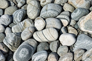 Banded and round gneiss, on the gravel beach, Geopark Scourie Bay, Sutherland, Scotland, United Kingdom, Europe Banded and round gneiss, on the gravel beach, Geopark Scourie Bay, Sutherland, Scotland, United Kingdom, Europe