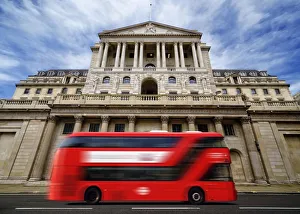 Bank of England with a passing red London double-decker bus, London, England, United Bank of England with a passing red London double-decker bus, London, England, United