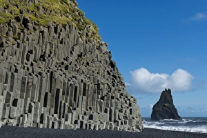 Basalt columns, Reynisfjara beach and one Reynisdrangar Pinnacle, near Vik i Myrdal Basalt columns, Reynisfjara beach and one Reynisdrangar Pinnacle, near Vik i Myrdal
