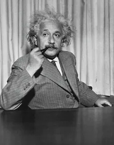 Albert Einstein Prints: Albert Einstein Smoking Pipe at Table