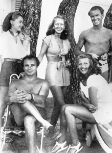 Prints of Ann Woodward (center) in 1948 at Chateau L'Horizon, property of Prince Aly Khan, bottom left, who would wed Rita Hayworth (bottom right) the next year Rita Prints: Ann Woodward with Rita Hayworth and Aly Khan Print, 1948