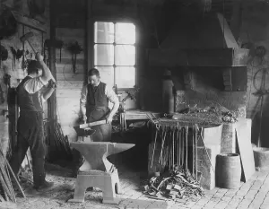 Blacksmiths at Work in an Old Iron Forge Print