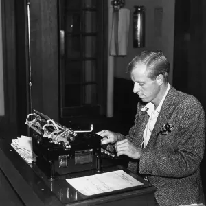 Caucasian Male In Suit Prints: Businessman using typewriter