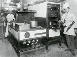 Vintage Kitchen Appliances Prints: Cooks Using Electrical Range