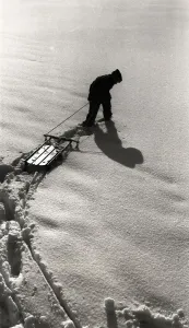 Child In Snow Prints: Figure Pulling a Sled