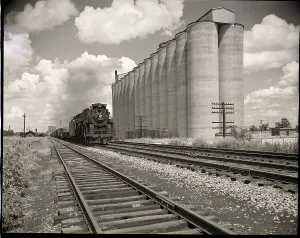 Railroad Tracks Prints: Freight Train Passing Grain Elevators