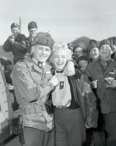 Prints of Master Sgt. Guy Morgan, of Marion, North Carolina, presenting a 25th Division Wolfhounds scarf to Marilyn Monroe Marilyn Monroe: The Eternal Star Prints: Marilyn Monroe with Master Sergeant Guy Morgan Print