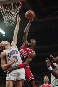 Prints of Chicago Bulls guard Michael Jordan shoots the basketball over his defender, Craig Ehlo of the Cleveland Cavaliers. Richfield, Ohio, April 16, 1989 Cleveland Prints: Michael Jordan Shooting Over Craig Ehlo Print, 1989