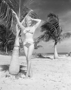 Vintage Bikini Styles Prints: Model Posing In A Bikini On The Beach