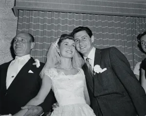 Print of Debbie Reynolds and Eddie Fisher embracing after their marriage