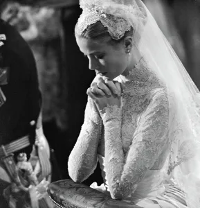 Prints of Grace Kelly prays during her wedding to Prince Rainier of Monaco on April 20, 1956 Monaco Prints: Fine Art Storehouse Print of Princess Grace at Her Wedding