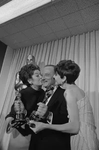 Rosalind Russell, Fred Zinnemann Holding Trophies Print