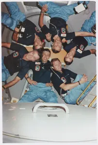 Medium Group Of People Images Prints: Space Shuttle Crew Posing While Practicing an Orbit