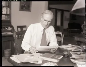 Upton Sinclair Reading at Desk Print, 8/29/1934