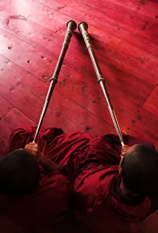Bhutan, Jakar, two monks playing horns, elevated view Bhutan, Jakar, two monks playing horns, elevated view