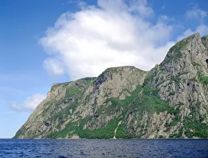 Billion year old rock of Long Range Mountains form steep cliffs above Western Brook Pond, Gros Morne National Park Billion year old rock of Long Range Mountains form steep cliffs above Western Brook Pond, Gros Morne National Park