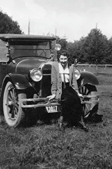 black & white, brunette, car, caucasian, eye contact, female, full-length, one person only black & white, brunette, car, caucasian, eye contact, female, full-length, one person only