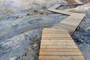 Boardwalk for tourists leading through the Seltun geothermal area near Krysuvik or Boardwalk for tourists leading through the Seltun geothermal area near Krysuvik or