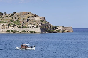 Boat off the Spinalonga peninsula, Kalidon, Elounda Gulf, Crete, Greece Boat off the Spinalonga peninsula, Kalidon, Elounda Gulf, Crete, Greece