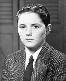 Serious boy (12-13) posing, (B&W), close-up, portrait Serious boy (12-13) posing, (B&W), close-up, portrait