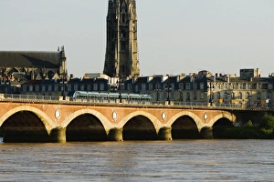 Cable car on a bridge, Pont De Pierre, St. Michel Basilica, Garonne River, Bordeaux Cable car on a bridge, Pont De Pierre, St. Michel Basilica, Garonne River, Bordeaux