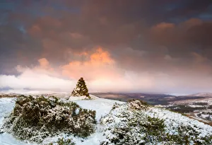 Cairn on snow covered hill fort at Cwmyoy near Abergavenny in the Black Mountains Cairn on snow covered hill fort at Cwmyoy near Abergavenny in the Black Mountains