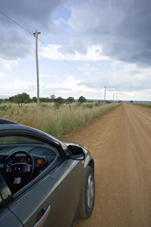 Car, Cloud, Dirt Road, Field, Land Vehicle, Landscape, Mode Of Transport, Non-Urban Scene Car, Cloud, Dirt Road, Field, Land Vehicle, Landscape, Mode Of Transport, Non-Urban Scene