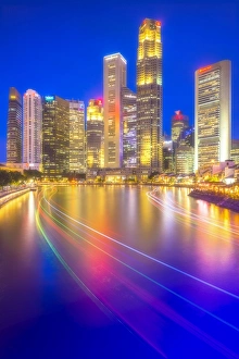 Central Business District view from Boat Quay with light trails in foreground, Singapore Central Business District view from Boat Quay with light trails in foreground, Singapore