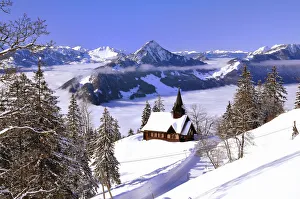Chapel in winter with view on the Hochflue and the Central Swiss Alps, Haggenegg, Canton of Schwyz, Switzerland Chapel in winter with view on the Hochflue and the Central Swiss Alps, Haggenegg, Canton of Schwyz, Switzerland