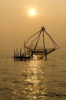 Chinese fishing net at sunrise, Vembanad lake, Kerala, India Chinese fishing net at sunrise, Vembanad lake, Kerala, India