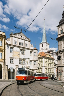 Classic red tram on the streets of Lesser own (Mala Strana) in Prague, Czech Republic Classic red tram on the streets of Lesser own (Mala Strana) in Prague, Czech Republic