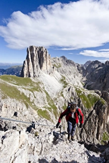 Climbers during the ascent to the Croda Rossa in the Rose Garden Group over the Croda Climbers during the ascent to the Croda Rossa in the Rose Garden Group over the Croda