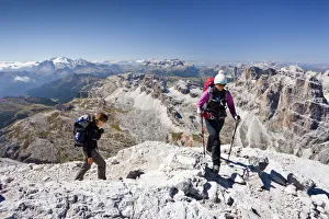 Climbers, ascent of the Tofane di Roze on the Giovanni Lipella via ferrata , behind the Sella and the Gardena Climbers, ascent of the Tofane di Roze on the Giovanni Lipella via ferrata , behind the Sella and the Gardena