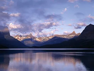 Clouds over lake surrounded by rocky mountains, Saint Mary Lake, Glacier National Park Clouds over lake surrounded by rocky mountains, Saint Mary Lake, Glacier National Park