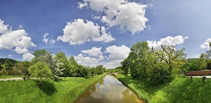 Clouds over the old Ludwig Canal or Ludwig-Donau-Main-Kanal with flowering fruit trees Clouds over the old Ludwig Canal or Ludwig-Donau-Main-Kanal with flowering fruit trees